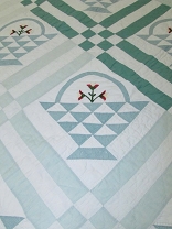 1. Embroidered Applique Basket Quilt